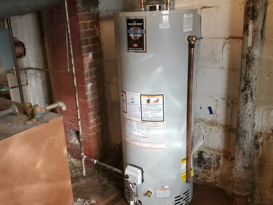Tank water heater replacement with new vent connections